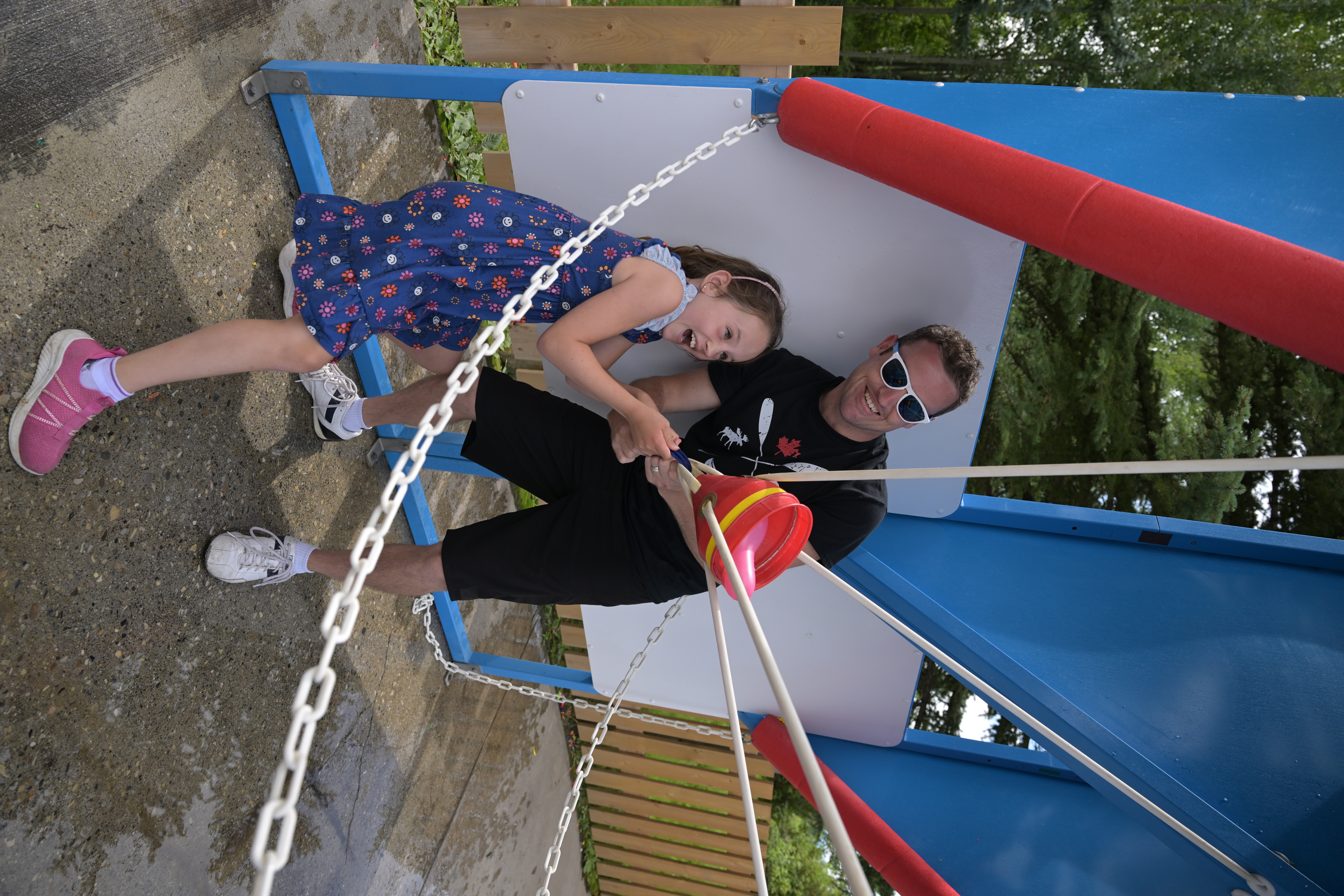Father and son playing the Water Wars Double Dyno water balloon game
